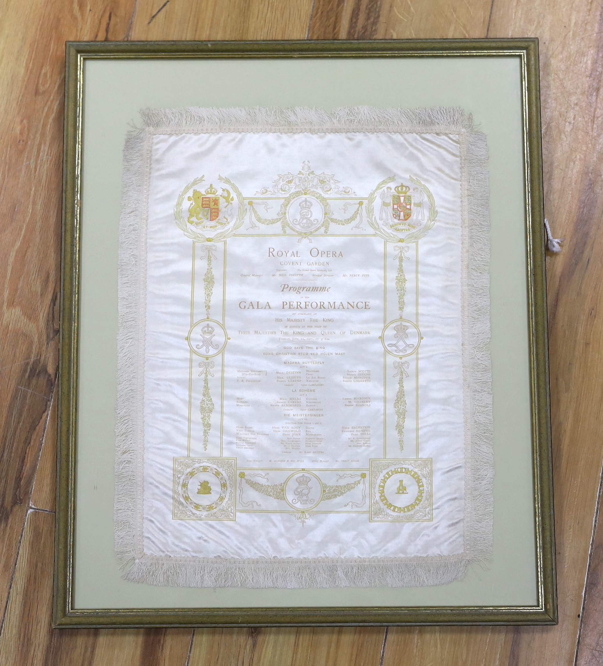 A framed early 20th century silk opera programme, Royal Opera House Covent Garden, Gala Performance 11th June 1907, printed by Finden Brown & Co., 37 x 28cm not including fringe